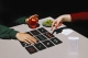 Playing the card game of visual acuity "dale al coco" designed by cocota studio with the design of packaging on the table.